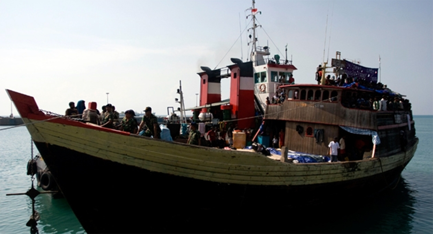 asylum seekers on fishing boat